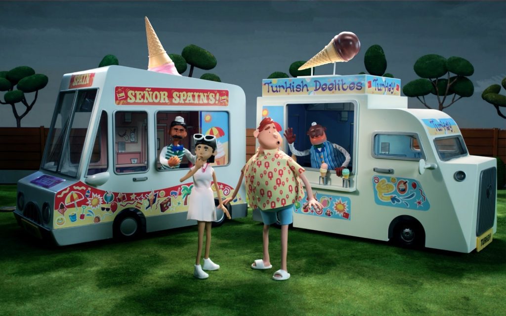 Stop motion still image of the Ice Lolly set. The image has two individuals stood in front of two ice cream vans