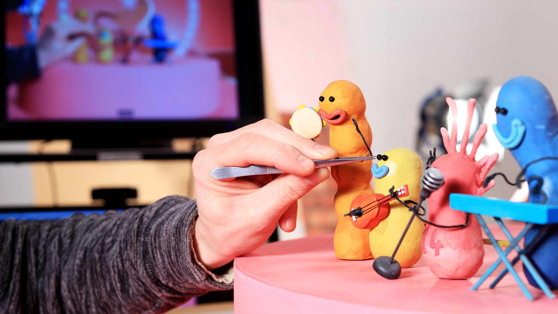 Team member setting up stop motion characters