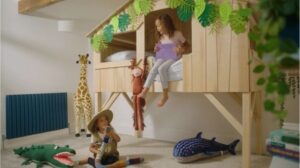 Children playing in a creative jungle-themed bedroom set, produced by Fresh Cut Creative, a top social media video production company in the UK.