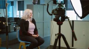A woman being interviewed in a professional office setting, filmed by Steady Hand Productions, a specialist in social media video production in the UK.
